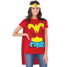 a woman wearing a red shirt and blue jeans with a wonder costume on her head