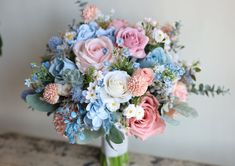 a bouquet of flowers sitting on top of a table