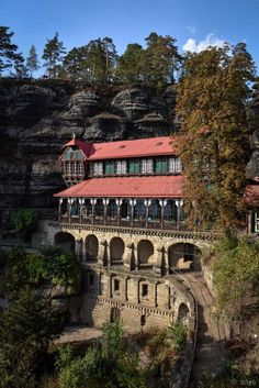 an old building on the side of a cliff