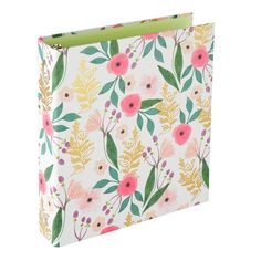 a white and pink flowered binder with green accents on the front, sitting against a white background