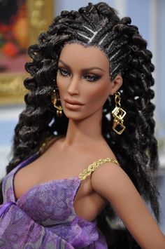 a close up of a barbie doll with braids on her head and wearing a purple dress