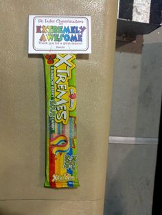 the candy bar has been placed on the refrigerator