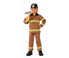 a little boy dressed in a fireman costume holding a banana and wearing a hat