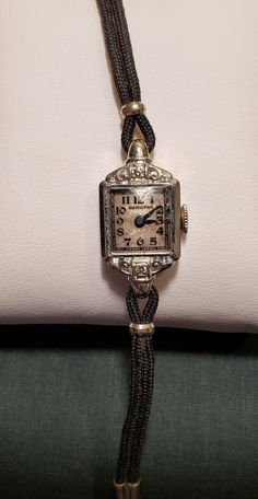 This is a stunning, dainty, Hamilton ladies wrist watch from the 1930's. It has a solid 14KT white gold bezel and case, the bezel also has two beautiful diamonds. The watch has the original gold plated band. It has 17 jewels. The hands move and the watch winds but it is not currently ticking. It will need to be serviced if planning to wear as a timepiece.  Very special vintage watch in wonderful vintage condition. I love finding and restoring, to the best of my ability, antique and vintage items Luxury Vintage Evening Watches, Luxury Antique Rectangular Watch, Luxury Antique Watch Accessories, Luxury Victorian Engraved Watch, Luxury Vintage Jewelry And Watches With Polished Finish, Luxury Vintage Watch Bracelet Strap, Cheap Vintage Watch Accessories For Women, Vintage Watch Chaika, Luxury Antique Self-winding Watch