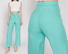 "Vintage 70s aqua blue trousers with a high waist and a straight leg. Measurements and Condition:    Fits like: Labeled size 10 petite, fits modern women's extra small regular Fabric: Polyester Brand: Stockton of Dallas Condition: Excellent   Waist: 24\" Hips: 36\" to 38\" - taken at the bottom of the zipper opening Rise: 12.25\" Inseam: 29\" Shown on a 5'9\" model with measurements of 33\"-24\"-37\", usually wears size XS to small. See our FAQ for more info on sizing and condition ratings." Light Blue Fitted Wide Leg Pants, Fitted Light Blue Wide Leg Pants, Fitted Turquoise Bottoms For Spring, Turquoise Fitted Bottoms For Spring, Turquoise Wide Leg Bottoms For Spring, Turquoise Wide-leg Bottoms For Spring, Blue Fitted High Rise Wide Leg Pants, Fitted High Rise Blue Wide Leg Pants, High Rise Fitted Blue Wide Leg Pants