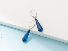 These unique Earrings are made of Precious Azure Amber. Handmade, Sterling Silver 925, Drop shaped, Blue Color. It is the perfect modern detail that will add Character to the look of a contemporary Person. PRODUCT DETAILS: ◾Color: Blue Color ◾Materials: Precious Azure Amber ◾Weight: ~ 3 gr WHERE TO FIND US? ◾Etsy: www.etsy.com/shop/AmberInnovators ◾Facebook: @AmberByMazukna ◾Instagram: @AmberByMazukna ◾Twitter: @AmberByMazukna ◾Website: www.amberbymazukna.com Blue Drop Earrings With Ear Wire, Blue Drop Earrings Hypoallergenic, Blue Hypoallergenic Earrings For Formal Occasions, Modern Blue Sterling Silver Earrings, Modern Blue Teardrop Jewelry, Elegant Blue Hypoallergenic Teardrop Earrings, Modern Blue Long Drop Jewelry, Blue Hypoallergenic Jewelry For Formal Occasions, Blue Nickel-free Drop Earrings