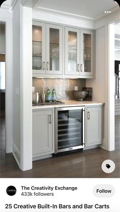 an image of a kitchen with white cabinets and silver appliances on the bottom right hand corner