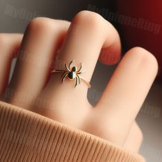 *Free engravings up to 20 characters* Weave into a world of intriguing elegance with this minimalist spider ring! 🌟 It's a fascinating adornment for your finger or a perfect gift for anyone captivated by the intricate and mysterious world of spiders. 🕷️💕 This ring, perfect for stacking or as a standalone piece, captures the allure and artistry of spiderwebs. Expertly crafted, it features a minimalist spider design along a delicate band, symbolizing the creativity and industrious nature of spiders. Whether you're drawn to the allure of these creatures or seeking a unique piece of jewelry, this spider ring is a distinctive and captivating choice, ready to accompany you on every intricate journey. ️🕷️ band width: 1.5mm Feel free to message us for customization! We can usually make minor a Spider Ring Gold, Minimalist Jewelry For Halloween Gift, Minimalist Halloween Jewelry Gift, Minimalist Halloween Gift Jewelry, Elegant Rings For Halloween Gifts, Elegant Rings As Halloween Gifts, Elegant Halloween Gift Ring, Elegant Halloween Ring Jewelry, Elegant Halloween Jewelry Rings