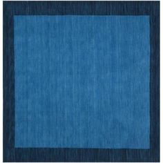 a blue area rug with black border