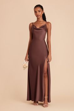 a woman wearing a brown dress with a slit