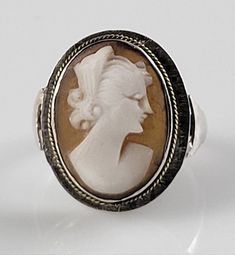 *Size 5 *Gorgeous genuine Carved Shell Cameo set in sterling Silver. *Simple, classic style with lovely fluted shoulders. *All hallmarks have since worn away. *Dates from the 1900s to 1910s. *This ring is in Excellent shape for being over 100 years old! It does show normal signs of wear & a moderate patina for its age. *Elegant Victorian Era piece you will enjoy for generations to come. Own a piece of history today! *You will receive the exact item pictured. *All professional cleaning is left up Topaz Yellow, Sterling Silver Garnet Ring, Sterling Silver Brooch, Carved Shell, Rhodolite Garnet, Natural Jade, Silver Brooch, White Topaz, Victorian Era