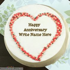 a heart shaped cake with the words happy anniversary any name here