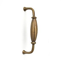 an antique brass door handle on a white background