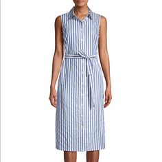 Let Them Ask You Where You Got Your Stunning Cotton Tommy Hilfiger Chambray Stripe Shirtdress. Fold-Over Collar. Sleeveless Construction. Front Button Closure. Tie At Waist. Straight Hemline. 100% Cotton. Machine Wash, Tumble Dry. Imported. Length 38 Inch Tommy Hilfiger Summer Beach Dress, Sleeveless Cotton Dresses By Tommy Hilfiger, Tommy Hilfiger Sleeveless Summer Dress, Sleeveless Cotton Shirt Dress For Daywear, Casual Fitted Sleeveless Shirt Dress, Sleeveless Cotton Shirt Dress, Sleeveless Cotton Shirt Dress For The Beach, Fitted Sleeveless Cotton Shirt Dress, Sleeveless Cotton Shirt Dress For Beach