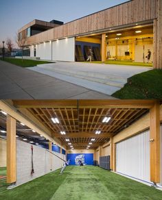 the inside and outside of a building with grass