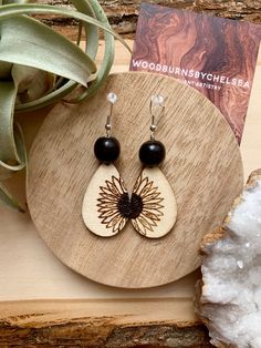 Wildflower design burnt to tear drop shaped wood blanks. Complete with gloss finish, silver wire wrap, sterling silver hook, and wooden beads. Chandbalis Earrings, Wildflower Design, Madison Wi, Monstera Leaf, Tear Drop, Wire Wrap, Wooden Beads, Silver Wire, Beautiful Earrings