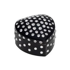 a black box with white polka dots on the lid and bottom, sitting in front of a white background