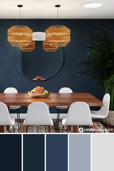 a dining room with blue walls, white chairs and a wooden table in the center