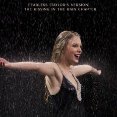 a woman is dancing in the rain with her arms spread out and she has her arm outstretched