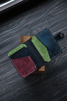 Multicolor minimalist leather wallet, bright bifold for man, comfortable spacious cardholder, pocket wallet  PRODUCT FEATURES  Stylish compact wallet with wide functionality. The accessory does not take up much space and fits in your pocket. The model is suitable for both men, women and children. The product is made of Italian buttero leather from the Walpier factory. It is one of the oldest tanneries in Italy, producing quality vegetable tanned leather. The factory is located in the historic ar Multicolor Bifold Card Holder, Multicolor Leather Bifold Wallet, Trendy Leather Wallet, Wallet Inspiration, Crochet Giraffe Pattern, Leather Wallet Design, Minimal Wallet, Leather Wallet Pattern, Minimalist Leather Wallet