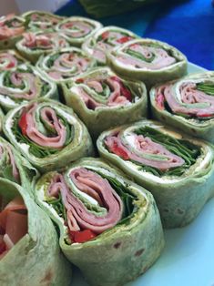 there are many rolls with meat and veggies in them