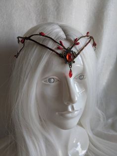 A simplistic yet elegant woodland tiara, featuring red berries surrounding the piece and a bronze charm with a smooth red rhinestone in the center. Perfect for weddings, parties, festivals, renaissance fairs, cosplay, or any event of your choosing! Also available with a silver charm! Red Fantasy Costume Headpieces, Red Headband Headpieces For Costumes, Red Headband For Costume, Red Crown Headpiece For Wedding, Red Crown Jewelry For Wedding, Red Festival Crown Headpiece, Red Adjustable Costume Headpieces, Red Adjustable Headpiece As A Gift, Red Adjustable Headpiece As Gift