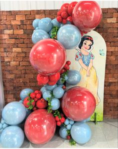 the balloon arch is decorated with red, white and blue balloons that spell out snow queen