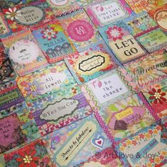 a quilt made with many different types of cards and sayings on the front side