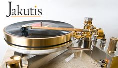 an antique record player is sitting on a table with the words jakutis above it