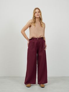 "ASHER is a high waisted tailored wide leg linen pants. DETAILS - High waisted - Seam pockets - Wide leg - Two front darts - Features hidden zip and the button in front - Elasticated back - 100% lightweight European linen fabric - Cut and sewn to order just for you in our studio COLOR - Eggplant, you can also choose other colors above - Fabric samples are available here https://www.etsy.com/listing/586569696/linen-fabric-samples SIZING & FIT - Fits true to size - Model is 5'8\" / 173cm and wearing a size S CARE FOR LINEN - Machine wash up to 30ºC/86ºF gentle cycle - Lay flat to dry or tumble dry low - Warm iron if needed - Do not bleach SIZE GUIDE Size conversion guide Size XS (US 0-2, IT 36-38, UK 4-6, Japan 3-5, France 32-34) Size S (US 4-6, IT 40-42, UK 8-10, Japan 7-9, France 36-38) Si Linen Wide-leg Culottes For Work, Wide Leg Linen Culottes For Work, Chic Linen Wide Leg Culottes, High Waist Linen Wide Leg Pants With Pockets, High-waisted Linen Wide Leg Pants For Work, High-waisted Linen Wide Leg Pants, High Waist Linen Wide Leg Pants, Ankle-length Linen Wide Leg Pants With Welt Pockets, Loosely Fitted Linen Wide Leg Pants For Work