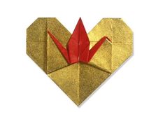 an origami crane is shown in the shape of a heart