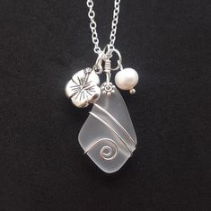 "Aloha! These design shows my love for this beautiful island of Hawaii. This item will be made to order and shipped directly from Hawaii. This is a sea glass pendant with a tarnish resistance silver plated chain necklace.The chain is a 20 inches long (can be customized from 30 inch down to any length if you leave me a note with the order for the preferred length) with a lobster claw catch. This handmade in Hawaii jewelry gift is from cultured sea glass that are specially formed into its shape fo Clear Sea Glass Jewelry For Gifts, Clear Sea Glass Jewelry Gift, Clear Sea Glass Jewelry For Gift, White Sea Glass Necklace For Gift, White Sea Glass Necklace As A Gift, Wire Wrapped Sea Glass Jewelry For Gifts, Wire Wrapped Sea Glass Jewelry Gift, White Recycled Glass Jewelry For The Beach, White Sea Glass Jewelry Gift