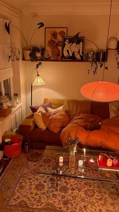 a living room filled with furniture and lots of pillows on top of a coffee table