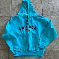 New Without Tags - Never Worn. Chicago Blue Pullover Hooded Sweatshirt With Hand-Warmer Pocket 1/4 Zip Size Medium. Measures Approximately 23” Armpit To Armpit, 24” From Shoulder To Hem. Sporty Blue Sweatshirt With Pockets, Blue Sports Tops With Pockets, Blue Fleece Tops With Letter Print, Blue Hooded Urban Top, Urban Blue Hooded Top, Urban Style Blue Hooded Top, Light Blue Fleece Casual Top, Casual Light Blue Hoodie With Letter Print, Blue Urban Sweatshirt For College