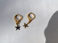 "FIRST TIME DISCOUNT: USE CODE FIRSTTIME20 FOR 20% YOUR FIRST ORDER! ♡ ALL PACKAGING IS 100% RECYCLABLE, BIODEGRADABLE, OR MADE FROM 100% RECYCLABLE MATERIALS ♡ ALL ORDERS NOW COME WITH A GIFT BOX! Listing comes with two earrings (aka: one pair) Dimensions: star: 12mm hoop: 11mm entire earring: around 1\" (one inch) long Materials: Gold: 14kt Gold Plated Gold Vermeil Gold Vermeil & CZ (cubic zirconia) 24kt Gold Filled Silver: Silver Plated Sterling Silver Sterling Silver & CZ (cubic zirc Minimalist Star-shaped Cartilage Earrings With Star Charm, Hypoallergenic Star-shaped Cartilage Earrings For Everyday, Nickel-free Star-shaped Cartilage Earrings As Gift, Nickel-free Star Cartilage Earrings As Gift, Nickel-free Star-shaped Cartilage Earrings For Gifts, Hypoallergenic Star-shaped Cartilage Earrings For Gift, Hypoallergenic Adjustable Star Earrings, Hypoallergenic Star-shaped Everyday Earrings, Hypoallergenic Star Earrings For Everyday