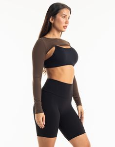 Functional athleisure at its finest. The Range Long Sleeve is the perfect garment to complete your workout look. Featuring a slim fit, super cropped length, the Range Long Sleeve is perfect to throw over your favorite ECHT sportsbra or with Range V3 Sportsbra as shown and matching Range Leggings! - Super Cropped Length - perfect with high-rise pants - Mix and match with your favourite ECHT sportsbra - Fabric: Super soft and breathable - Slim fit skims your body - Silver logo on sleeve - Breathability and ease of movement 81% Nylon, 19% Spandex Range V3 Sportsbra is sold separately. Versatile Cropped Sports Top, Fitted Moisture-wicking Crop Top For Workout, Breathable Stretch Cropped Tops, Moisture-wicking Fitted Crop Top For Workout, Black Seamless Construction Crop Top Activewear, Compressive Black Crop Top For Pilates, Black Seamless Crop Top Activewear, Black Moisture-wicking Crop Top Activewear, Moisture-wicking Black Crop Top Activewear