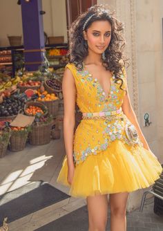 Editor's Note A Yellow Raw Silk Waistcoat Babydoll Dress With A Yellow Tulle Bottom, Embroidered With 3D Flowers, Gold Bangles, Glass Stones, Colored Beads And Pearls Note: Waist Bag Worn By Model Is For Styling Purposes Only. Color: Yellow Fabric: Raw Silk, Tulle Embroidery Details: 3D Flowers, Gold Bangles, Glass Stones, Beads And Pearls Neckline: Plunge Sleeve Type: Sleeveless Component: Dress Care: Dry Clean Only About the Designer Papa Don’t Preach By Shubhika For Girls Who Effortlessly Dis Elegant Royal Dresses, Yellow Waistcoat, Indian Reception Outfit, Mehandi Dress, Pride 2024, Haldi Dress, Short Frocks, Mini Frock, Indian Reception