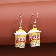 pair of popcorn cup earrings with dangling hooks