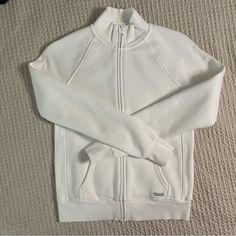 Aritzia Tna Cozy Fleece Snug Zip Hoodie In White. This Is A Snug-Fitting Zip Hoodie With A Kanga Pocket And Ribbed Trim. It’s Made With Tna’s Cozy Fleece Premium, Midweight Fleece Famous For Its Soft-Brushed Back, Sueded Face And Cloud-Nine Cozy Feel. The World's Best. Size Xs. Brand New Without Tags. Fitted White Sweatshirt For Fall, Fitted Casual Fleece Tops, White Stretch Cozy Outerwear, White Fitted Sweatshirt For Loungewear, Fitted White Sweatshirt For Loungewear, White Sporty Cozy Fit Top, Cozy Fit White Athleisure Outerwear, White Fitted Sweatshirt Athleisure, White Cotton Outerwear For Loungewear