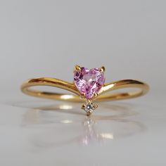 This 14K Pink Sapphire Heart ring makes for a perfect promise ring, or as a gift for your beloved. Nothing like saying "I love you" with this dainty beauty top with a natural white diamond. Perfect to wear alone or stacked with other ring bands. Available in 14k yellow gold, rose gold, and white gold. Pair it with our Siren Marquise ring or Winter Palace Marquise ring (as pictured) for the ultimate majestic look. This ring is designed and made in NYC. 14K solid gold band Natural pink heart sapph Pink Gold Heart Promise Ring In Fine Jewelry Style, Heart-shaped Pink Gold Promise Jewelry, Pink Heart-shaped Promise Ring, Pink Gold Heart Ring For Promise, Fine Jewelry, Elegant Pink Heart-shaped Ring, Marrying Rich, Aesthetic Supplies, Sapphire Heart Ring, Ring Bands