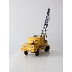 a toy truck with a crane on the back