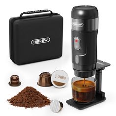 the coffee maker is being used to make espresso in front of other items