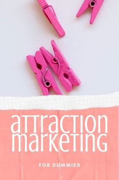 pink paper clips with the words attraction marketing for dummies on top of them