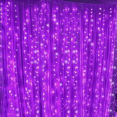 a purple curtain with lights on it