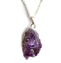 Amethyst Crystal Pendant Necklace. Multiple, natural amethyst points in a deep, dark purple give you ultimate purple perfection. Delight your neck with this whimsical, weighty chunk. Each stone is unique, so shape, clarity and size may vary. • 16" silver plate chain. Wear it close!• Lobster clasp closure• Silver electroplated base• Natural amethyst stone• Pendants average 25 mm wide, 25mm tall, 30mm thick Handmade in the USA in our Detroit, Michigan studio. This item is available for immediate s Purple Amethyst Pendant Crystal Necklace, Purple Amethyst Necklace With Raw Stone, Spiritual Purple Necklace With Large Stone, Purple Raw Stone Crystal Pendant Necklace, Purple Raw Stone Necklaces For Healing, Purple Amethyst Crystal Necklaces With Natural Stones, Purple Raw Stone Crystal Necklace For Healing, Spiritual Purple Crystal Necklace With Raw Stone, Healing Purple Crystal Necklace With Raw Stone