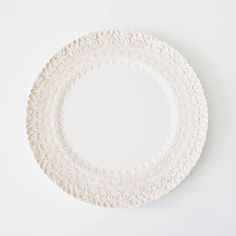 a white plate sitting on top of a table