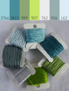 four skeins of yarn in different colors on a white background with text overlay