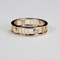 Our custom graduation class roman numeral ring in 14k, 18k gold or platinum is personalized with the date and university/high school of your choice. Available with our without a diamond accent stone. Details: - Made to order in New York City - Solid gold 14k, 18k gold or platinum - Default size is between 4-5.5mm tall and 2mm wide. Contact us if you want different dimensions. - Conflict free diamond accent is a round 2mm full cut with VS clarity with G color. (if diamond accent is purchased) - W Non Traditional Class Rings, Class Jewelry, Class Rings High School, Roman Numeral Ring, Couple Bands, Roman Numerals Dates, Class Rings, Gold Class, Graduation Rings