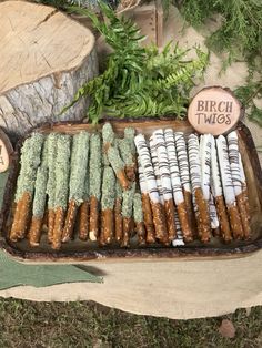 there are many different types of food on the trays in this tableclothed display