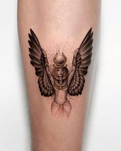 a woman with wings on her leg is shown in black and grey tattoo art work